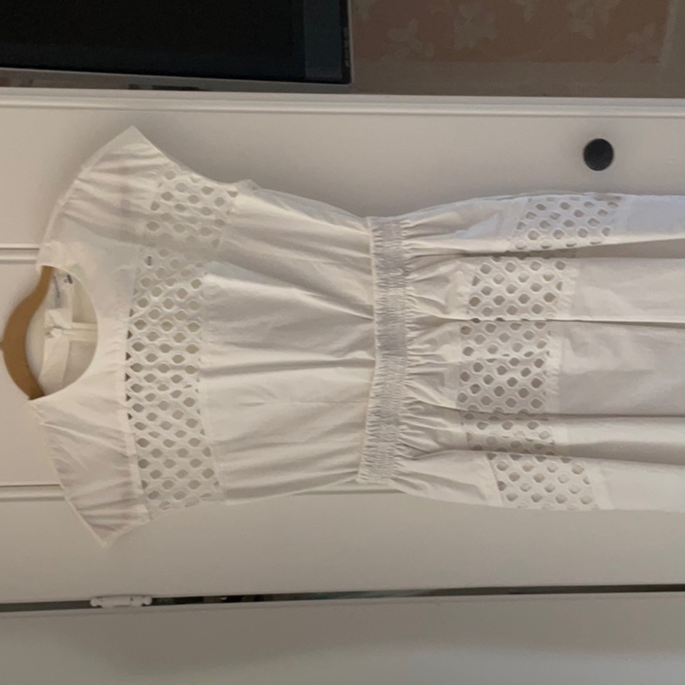 Brand new designer dress in white.